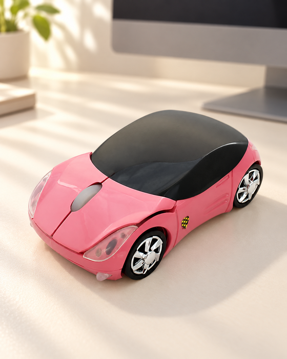 Pink car-shaped wireless mouse on an ivory desk beside a monitor.