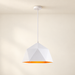 White faceted pendant light with orange interior against ivory room