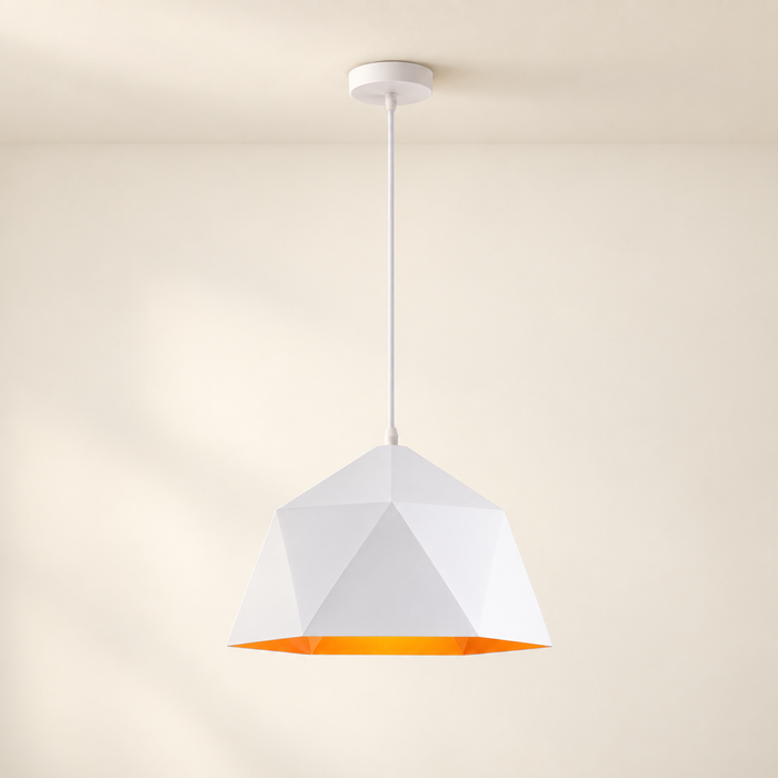 White faceted pendant light with orange interior against ivory room