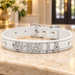 White collar with BELLA crystal letters and crown on an ivory console.