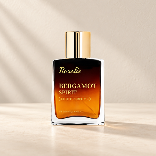 Amber fragrance bottle with gold cap on an ivory vanity.