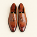 Brown tassel loafers with wooden shoe trees