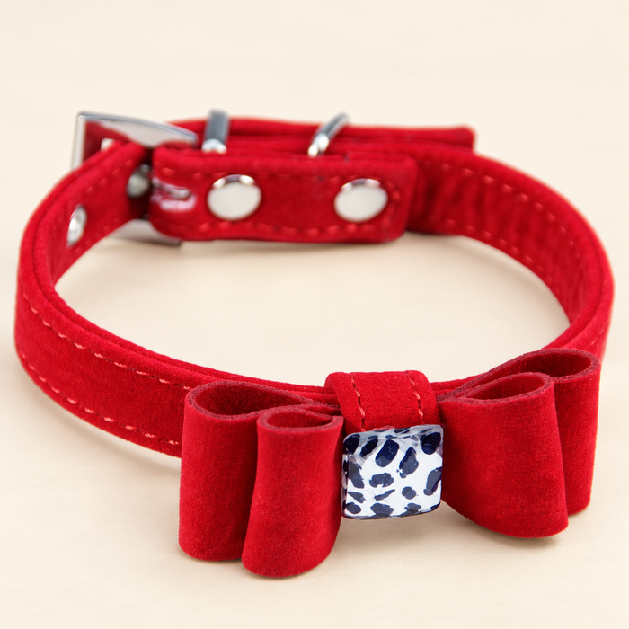 Red bow pet collar with white and navy spotted centre ornament