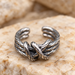 Textured silver open ring with a front knot on ivory stone