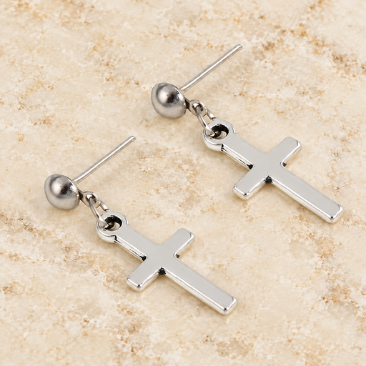 Silver cross drop stud earrings on ivory stone