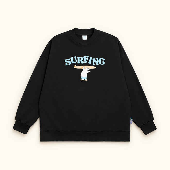 Black SURFING sweatshirt laid flat on ivory background