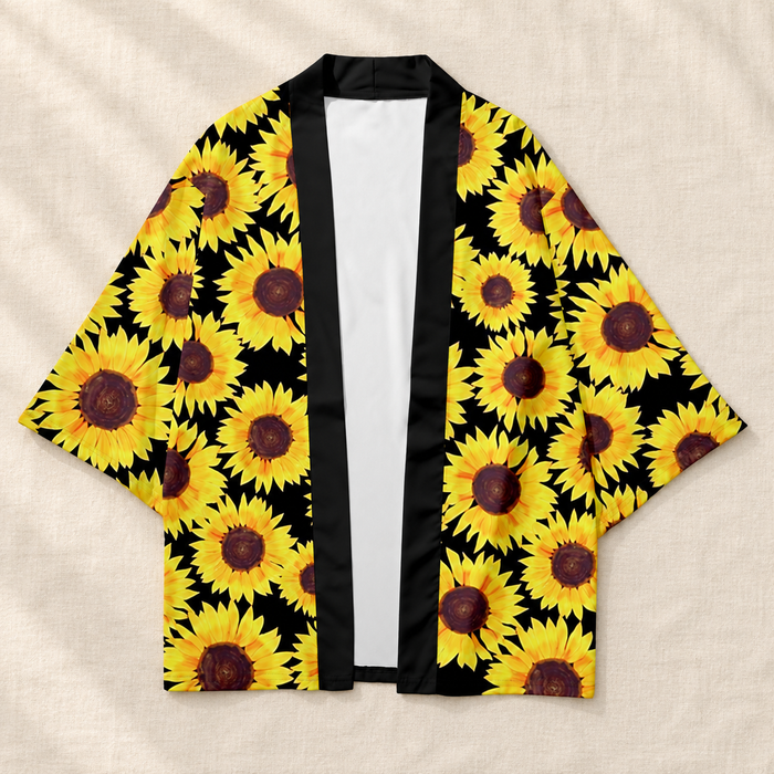Black open cardigan with yellow sunflower print on ivory linen.