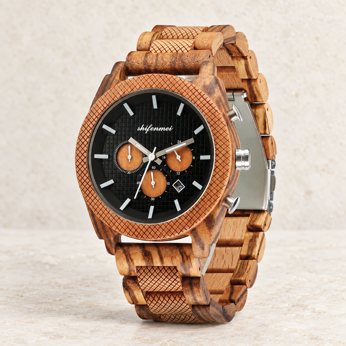 Wooden chronograph-style watch on ivory stone.