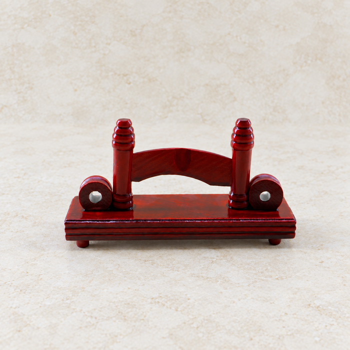 Dark red wooden fan stand on ivory stone.