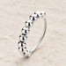 Silver bead ring on ivory stone.