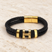Black double braided bracelet with gold fittings on ivory stone