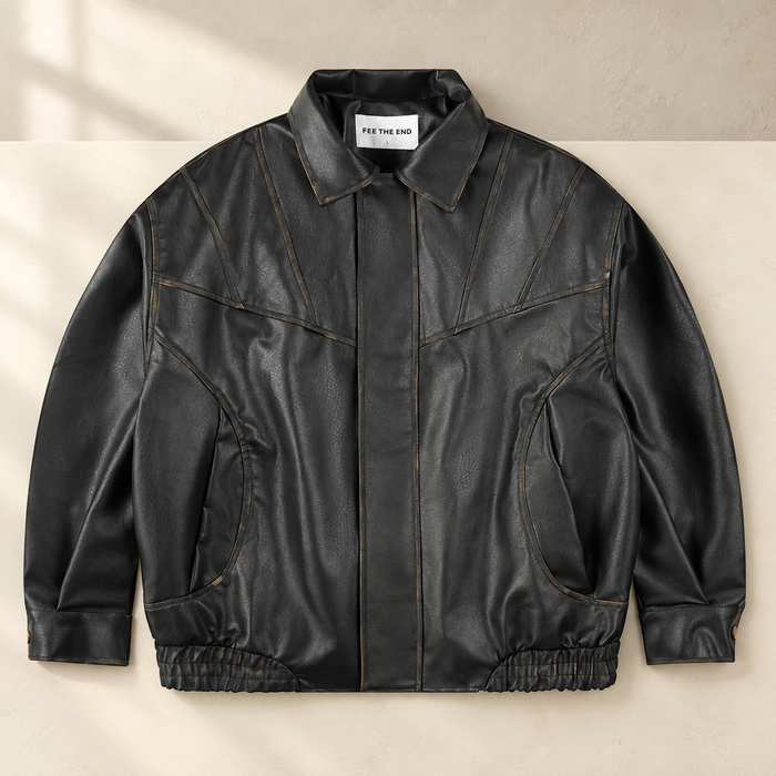 Black retro jacket with curved pockets on an ivory surface