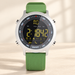 Green strap silver digital watch on ivory surface