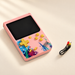 Pink handheld game console with yellow controls and cable