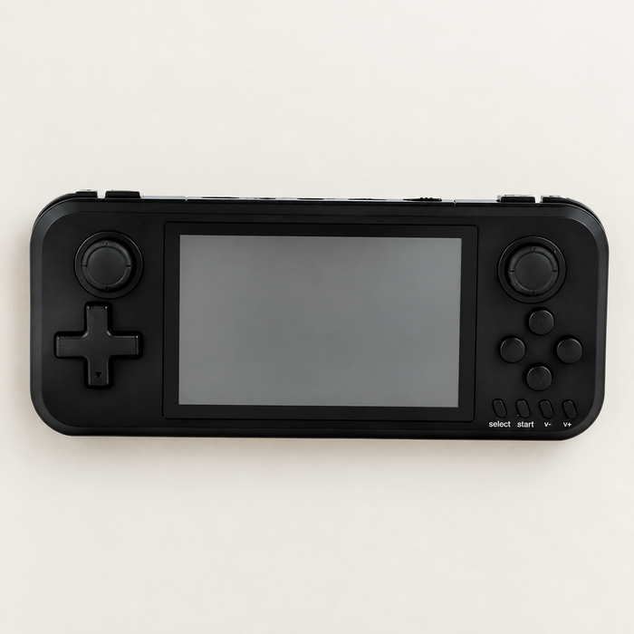 Black handheld game console with a blank screen on an ivory surface