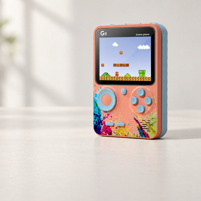 Coral G5 handheld game console with blue controls on an ivory tabletop