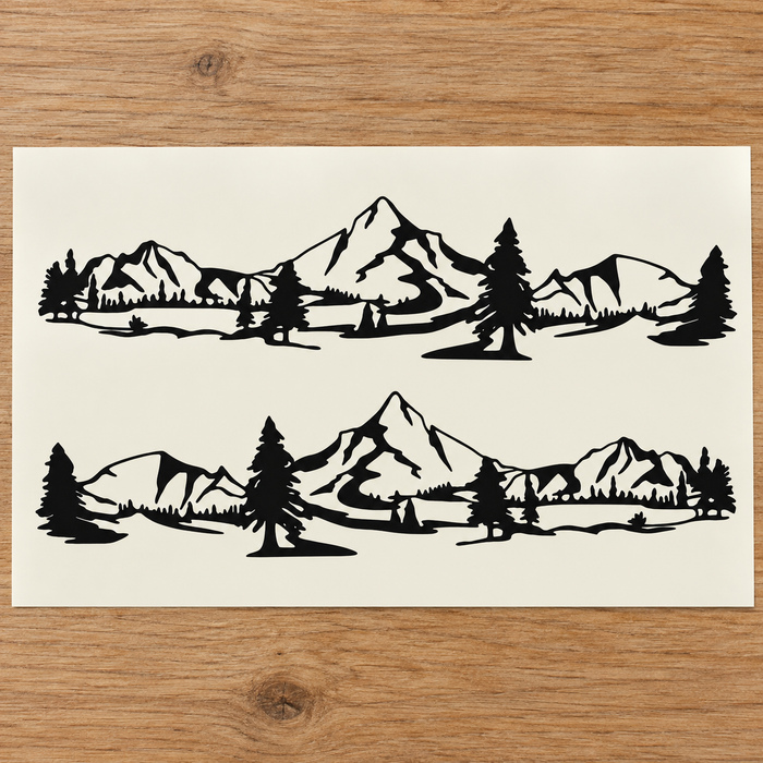 Pair of black mountain and pine-tree car decals displayed on a light backing sheet.