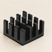 Black pin-fin heat sink on an ivory workbench.
