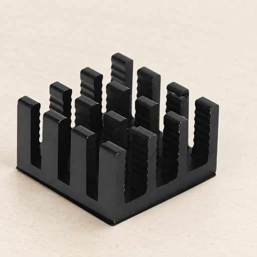 Black pin-fin heat sink on an ivory workbench.