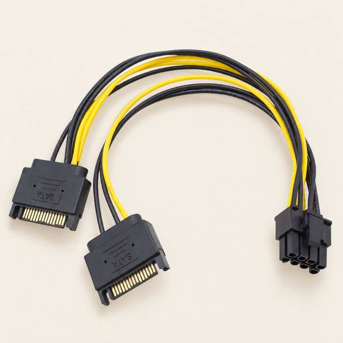 Yellow and black graphics card power cable with two SATA connectors and one eight-cavity connector on an ivory surface.