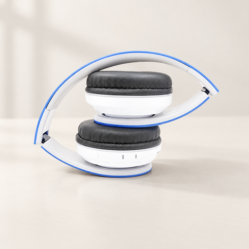 Folded white and blue headphones on an ivory desk.