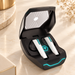 Open black gaming earbud case with white earbuds and cyan lighting