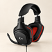 Black and red G331 gaming headset with boom microphone on an ivory surface