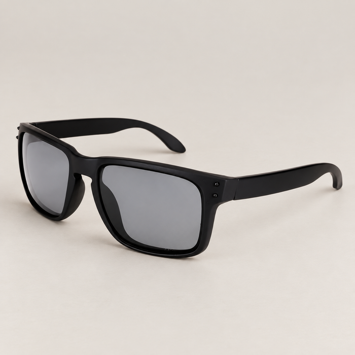 Black sunglasses with grey lenses on ivory surface