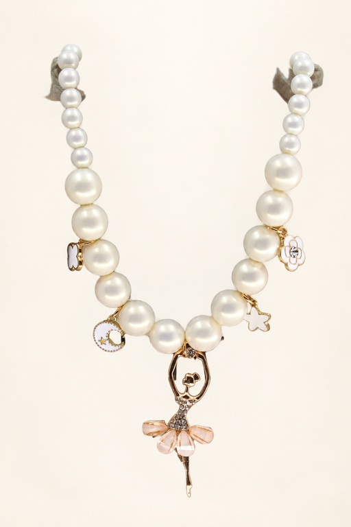 White pearl necklace with enamel charms and a ballerina pendant on two supports