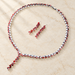 Red and clear stone necklace with matching earrings