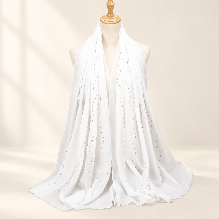 White scarf with dotted wave embellishments on mannequin