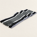 Grey striped fringed scarf folded on ivory textile