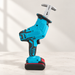 Turquoise cordless reciprocating saw on an ivory worktable