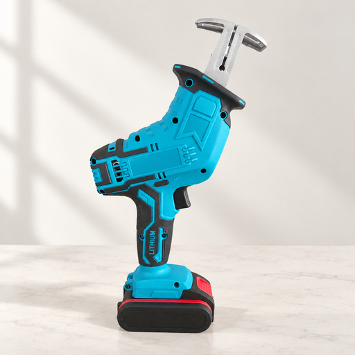 Turquoise cordless reciprocating saw on an ivory worktable