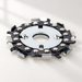 Chain cutting disk with silver centre plate on an ivory surface