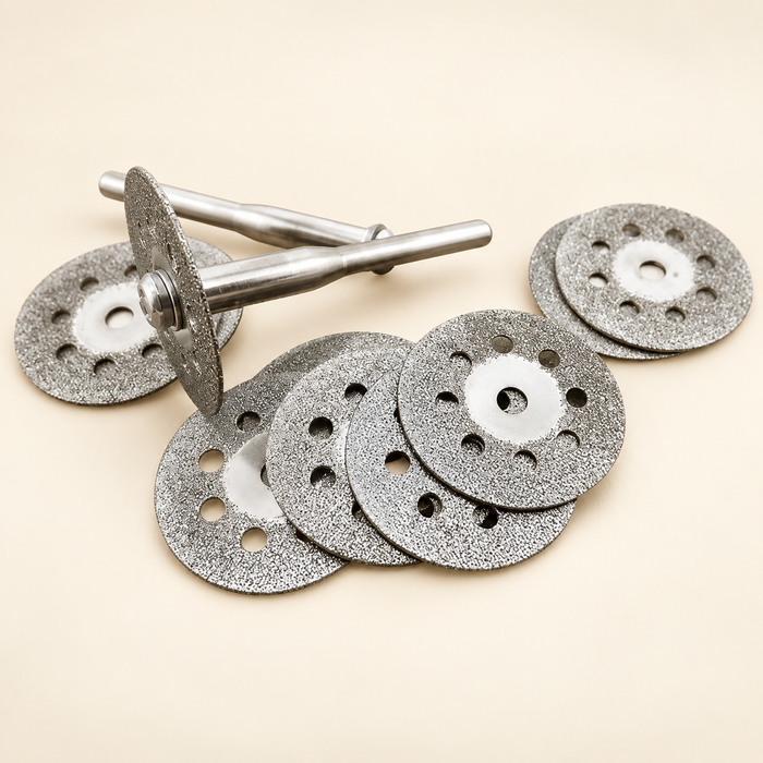 Diamond cutting discs and mandrels on ivory surface