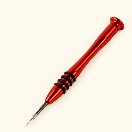 Red precision screwdriver with four black grip rings resting diagonally on an ivory surface.