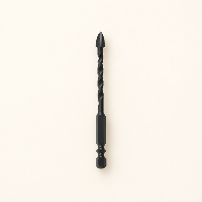 Single black cross-triangle drill bit on ivory surface