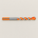 Orange and silver drill bit lying flat on ivory
