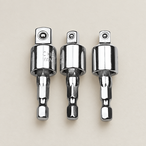 Three silver socket adapters laid on an ivory workbench.