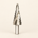 Metal step drill bit with engraved size markings on an ivory surface
