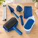 Blue painting tools and three metal extension sections arranged on a wooden work surface.