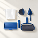 Blue paint roller kit with tray, pouring cup and corner pad on an ivory surface