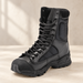 Black lace-up boot with mesh panels and rugged sole on a pale surface