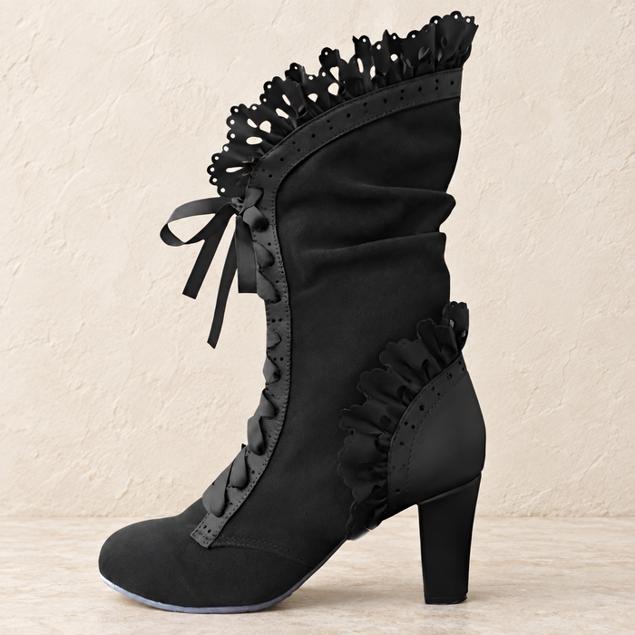 Black lace-up boot with ribbon bow, ruched panels and perforated ruffle trim