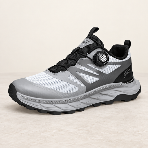Grey and white dial-lace sneaker on an ivory stone surface