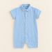 Blue gingham short sleeve baby romper on ivory tabletop