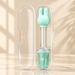 Mint rabbit feeding dispenser in open clear case on ivory surface