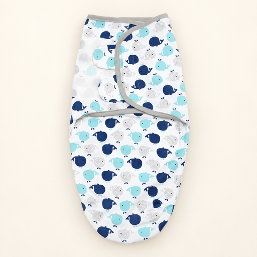 White baby swaddle with whale print on ivory background